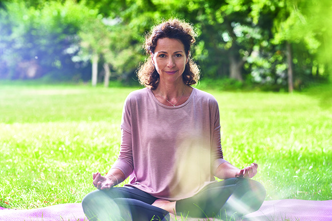 woman cross-legged example image balance body and mind